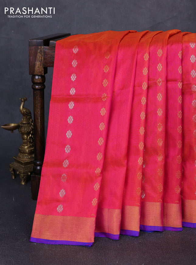 Pure uppada silk saree dual shade of pinkish orange and blue with allover silver & gold zari woven floral buttas and zari woven border