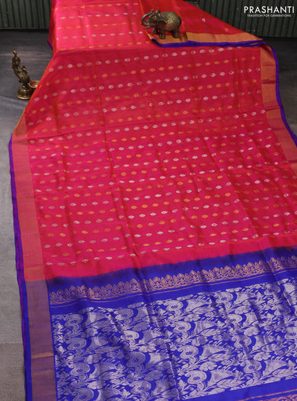 Pure uppada silk saree dual shade of pinkish orange and blue with allover silver & gold zari woven floral buttas and zari woven border