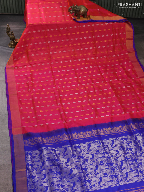 Pure uppada silk saree dual shade of pinkish orange and blue with allover silver & gold zari woven floral buttas and zari woven border