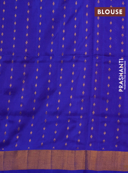 Pure uppada silk saree dual shade of pinkish orange and blue with allover silver & gold zari woven floral buttas and zari woven border
