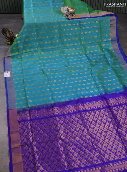 Pure uppada silk saree dual shade of teal bluish green and blue with allover zari woven buttas and zari woven border