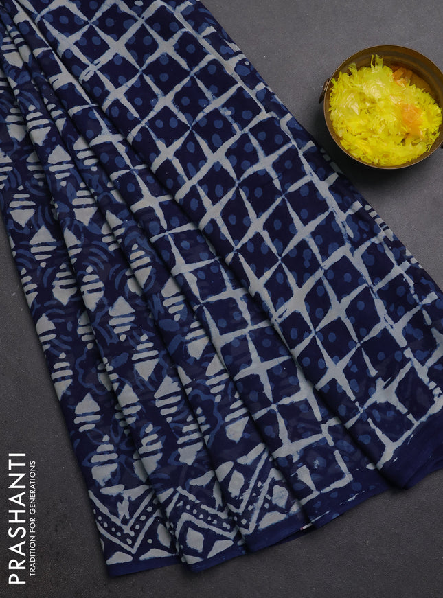 Georgette saree indigo blue with allover dabu prints and printed border