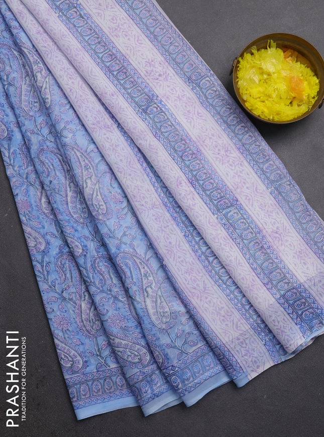 Georgette saree light blue and off white with allover block prints and printed border