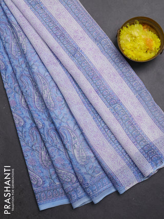 Georgette saree light blue and off white with allover block prints and printed border