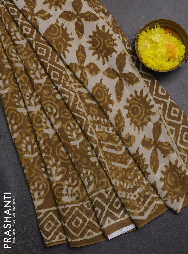 Georgette saree khaki shade with allover dabu prints and printed border