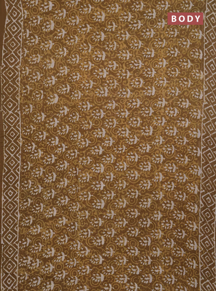 Georgette saree khaki shade with allover dabu prints and printed border