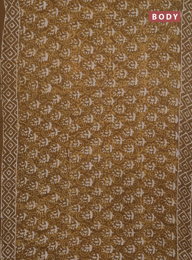 Georgette saree khaki shade with allover dabu prints and printed border
