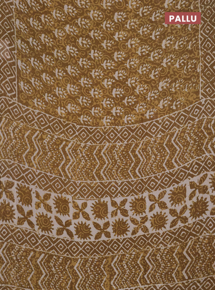 Georgette saree khaki shade with allover dabu prints and printed border