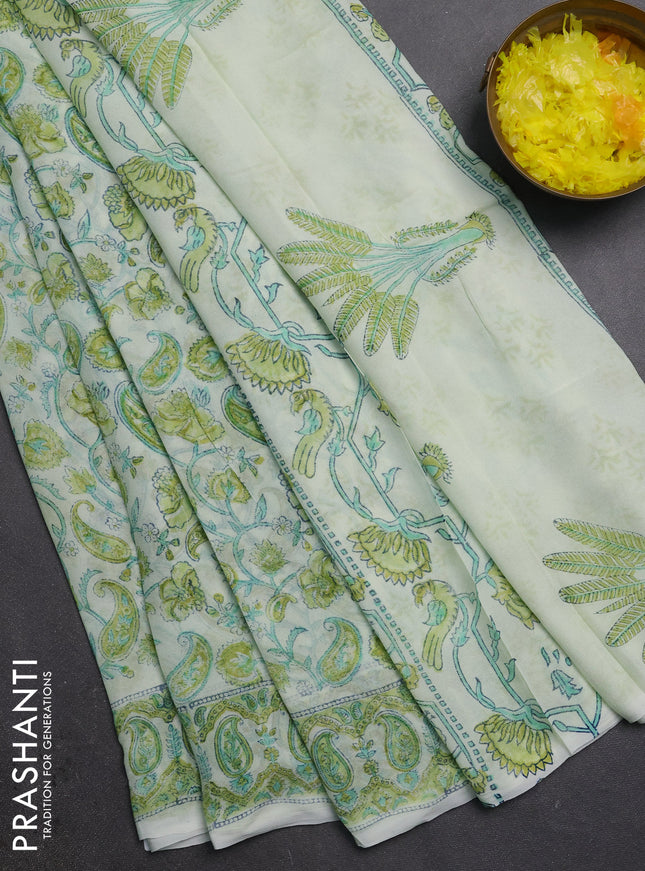 Georgette saree cream and lime green with allover block prints and printed border