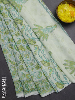Georgette saree cream and lime green with allover block prints and printed border