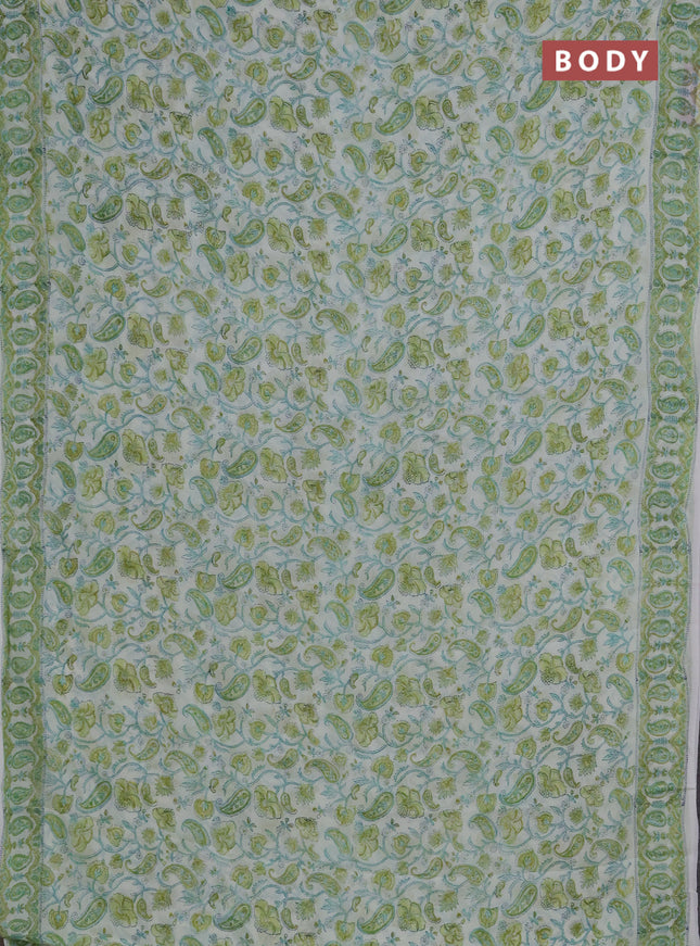 Georgette saree cream and lime green with allover block prints and printed border
