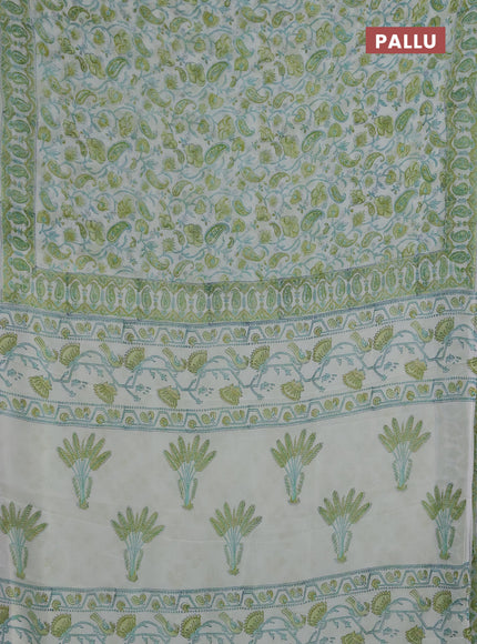 Georgette saree cream and lime green with allover block prints and printed border