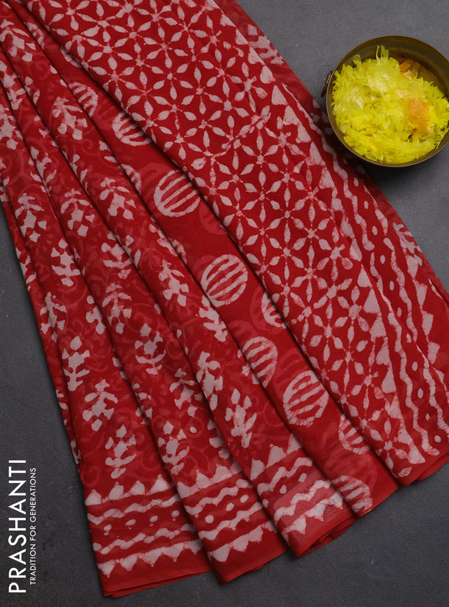 Georgette saree rustic orange with allover dabu prints and printed border