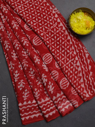 Georgette saree rustic orange with allover dabu prints and printed border