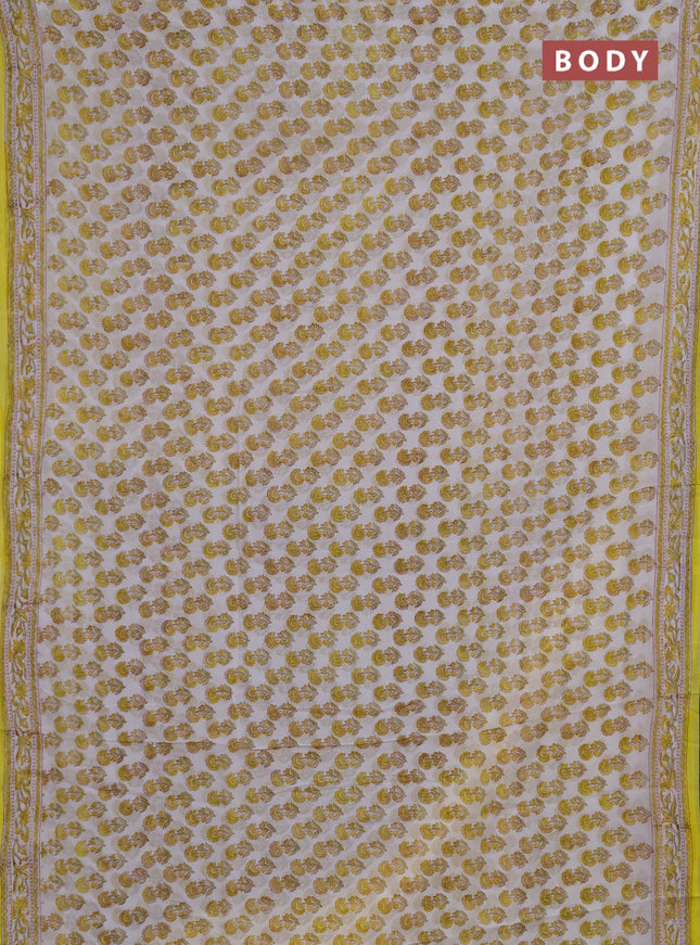 Georgette saree off white and yellow with allover floral butta block prints and printed border
