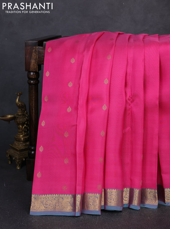 Kanchipuram silk saree pink and dual shade of teal green with allover zari woven buttas and zari woven border