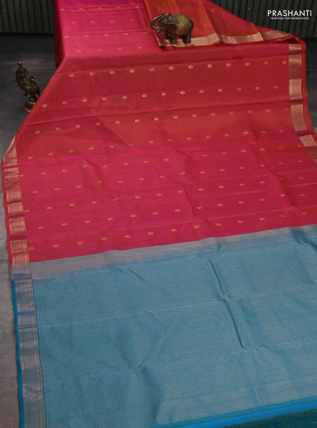 Kanchipuram silk saree dual shade of pinkish orange and teal green with allover vairosi pattern & zari buttas and zari woven border