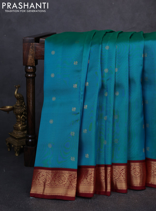 Kanchipuram silk saree dual shade of peacock green and maroon with allover zari woven buttas and zari woven border