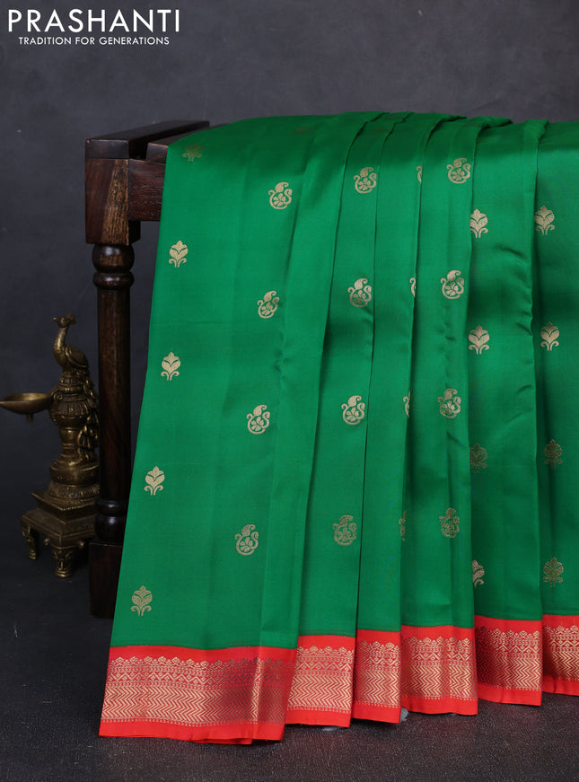 Kanchipuram silk saree light green and orange with allover zari woven buttas and zari woven border
