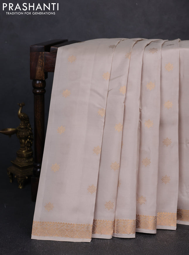 Kanchipuram silk saree beige and purple with zari woven buttas and zari woven border