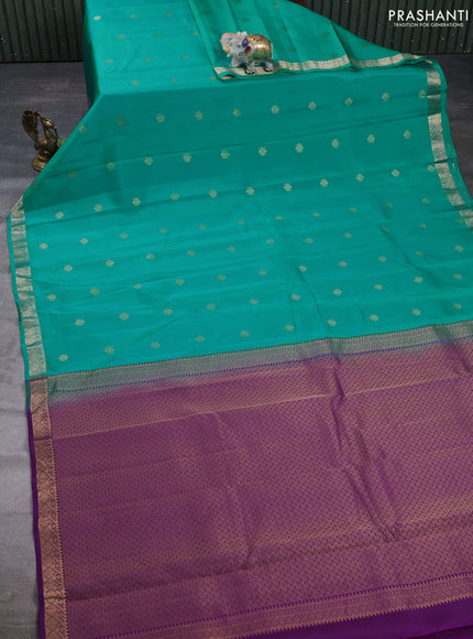 Kanchipuram silk saree teal green and purple with allover zari woven buttas and zari woven border