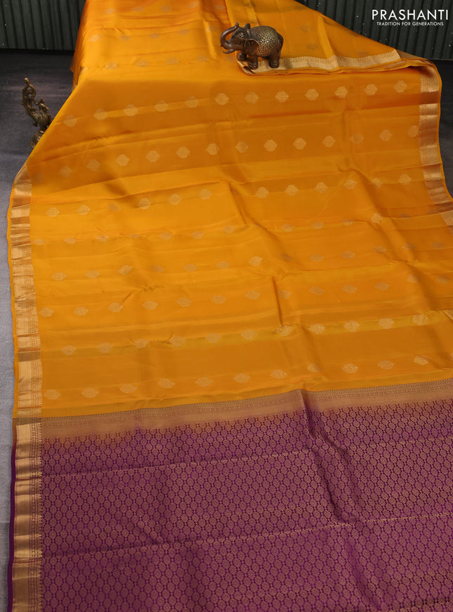 Kanchipuram silk saree mustard yellow and purple with allover zari woven buttas and zari woven border