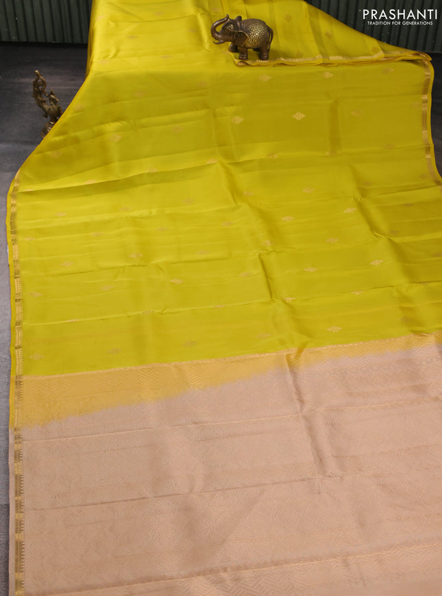 Kanchipuram silk saree lime yellow and beige with allover zari woven buttas and small zari woven border