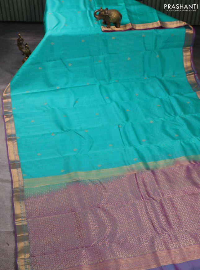 Kanchipuram silk saree teal green and dual shade of purple with allover zari woven stripes & buttas and zari woven border