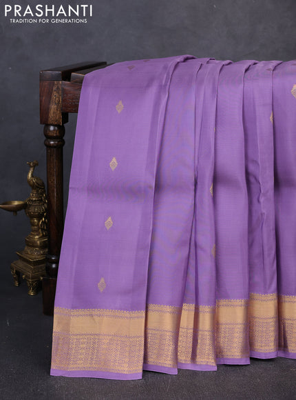 Kanchipuram silk saree lavender and teal green with allover zari woven buttas and rich zari woven border