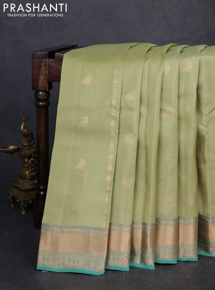 Kanchipuram silk saree pastel green and teal green with allover zari woven stripes & buttas and zari woven simple border