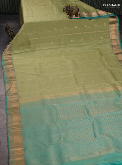 Kanchipuram silk saree pastel green and teal green with allover zari woven stripes & buttas and zari woven simple border