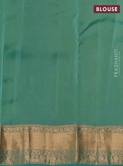Kanchipuram silk saree pastel green and teal green with allover zari woven stripes & buttas and zari woven simple border