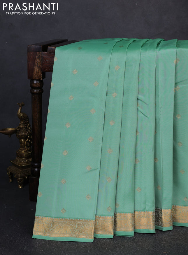Kanchipuram silk saree teal shade and dark pink with allover zari woven buttas and zari woven border