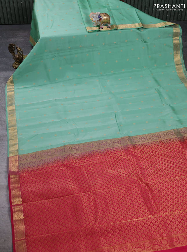 Kanchipuram silk saree teal shade and dark pink with allover zari woven buttas and zari woven border