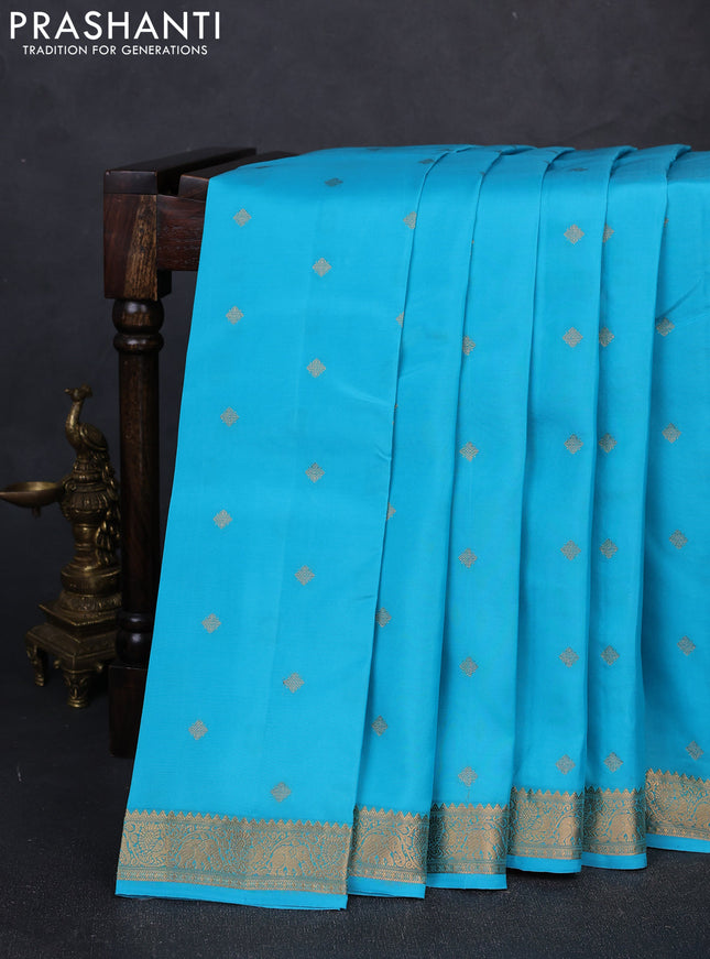 Kanchipuram silk saree teal blue and tomato pink with allover zari woven buttas and zari woven border