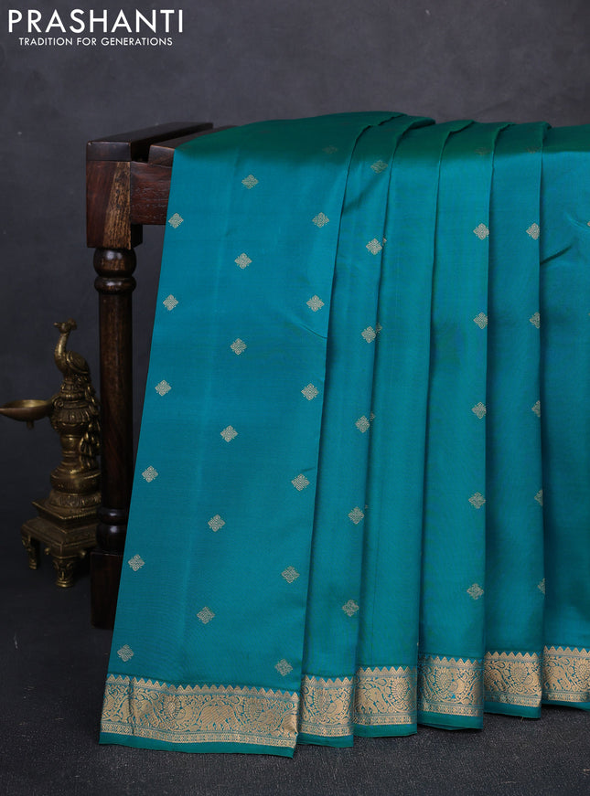 Kanchipuram silk saree teal green and pink with allover zari woven buttas and zari woven border