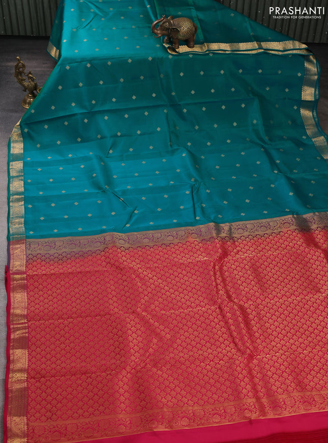 Kanchipuram silk saree teal green and pink with allover zari woven buttas and zari woven border
