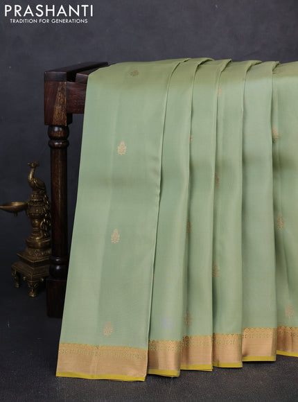Kanchipuram silk saree pastel green and mustard green with allover zari woven buttas and zari woven border