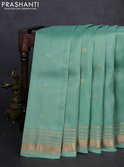 Kanchipuram silk saree pastel green and purple with allover zari woven stripes & buttas and zari woven border