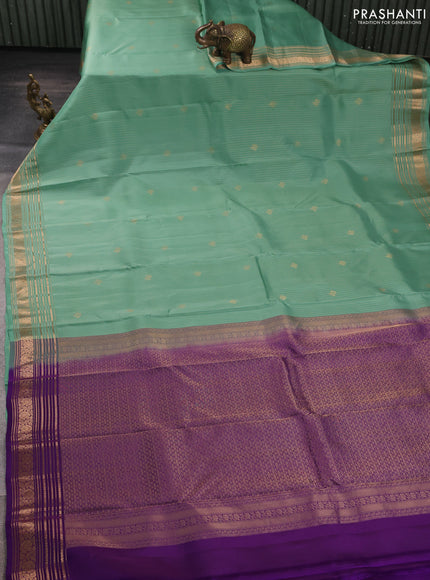 Kanchipuram silk saree pastel green and purple with allover zari woven stripes & buttas and zari woven border