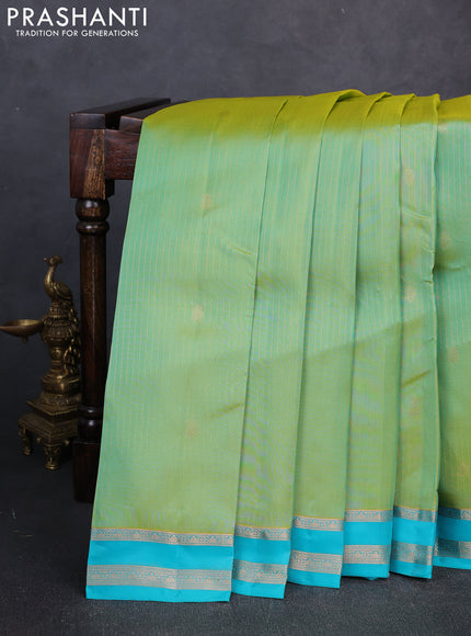 Kanchipuram silk saree dual shade of teal green and teal blue with allover zari woven stripes & buttas and zari woven border