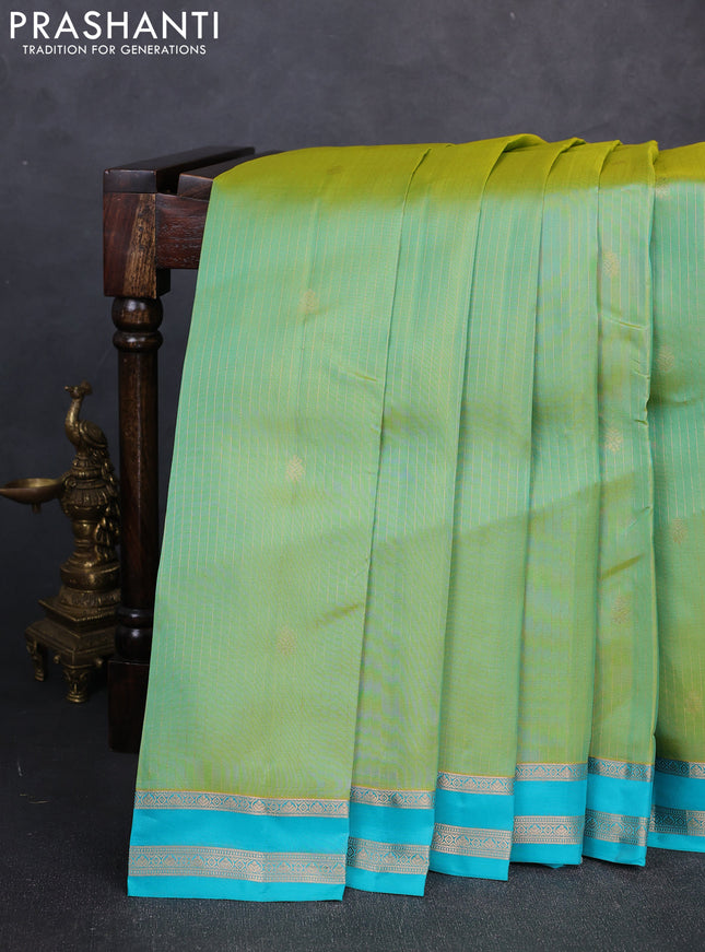 Kanchipuram silk saree dual shade of teal green and teal blue with allover zari woven stripes & buttas and zari woven border