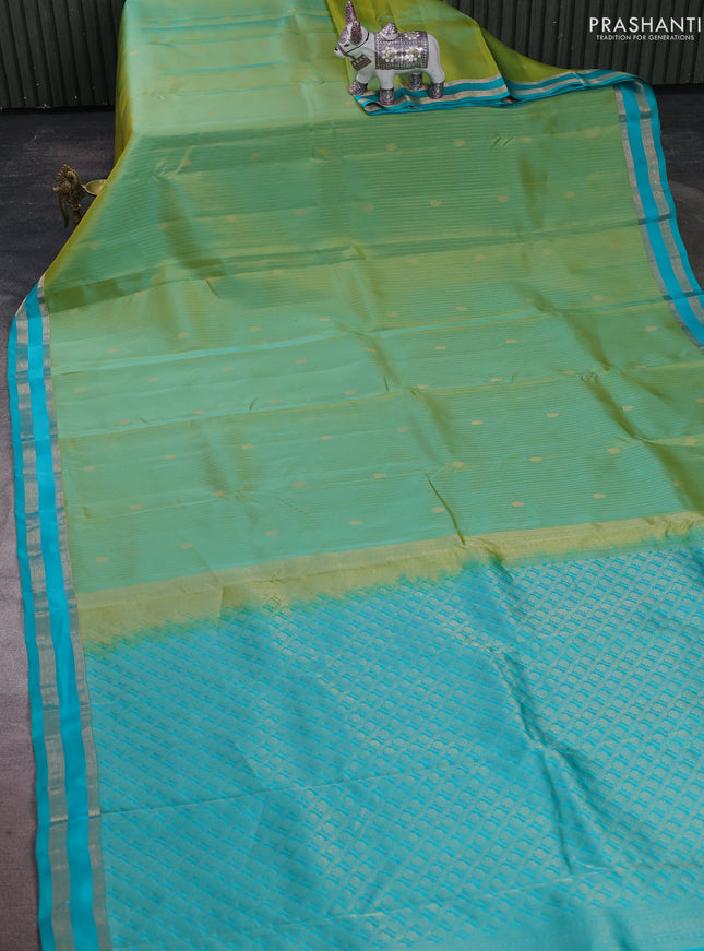 Kanchipuram silk saree dual shade of teal green and teal blue with allover zari woven stripes & buttas and zari woven border