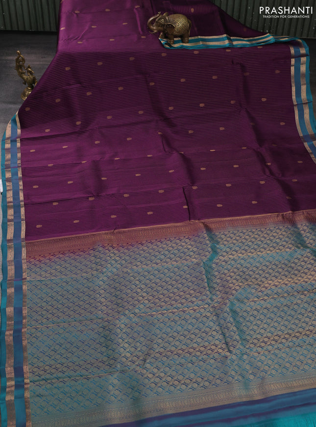 Kanchipuram silk saree deep purple and peacock green with allover zari woven stripes & buttas and rettapet zari woven border