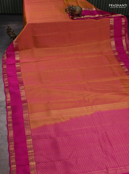 Kanchipuram silk saree dual shade of pinkish orange and pink with allover zari checked pattern and rettapet zari woven border