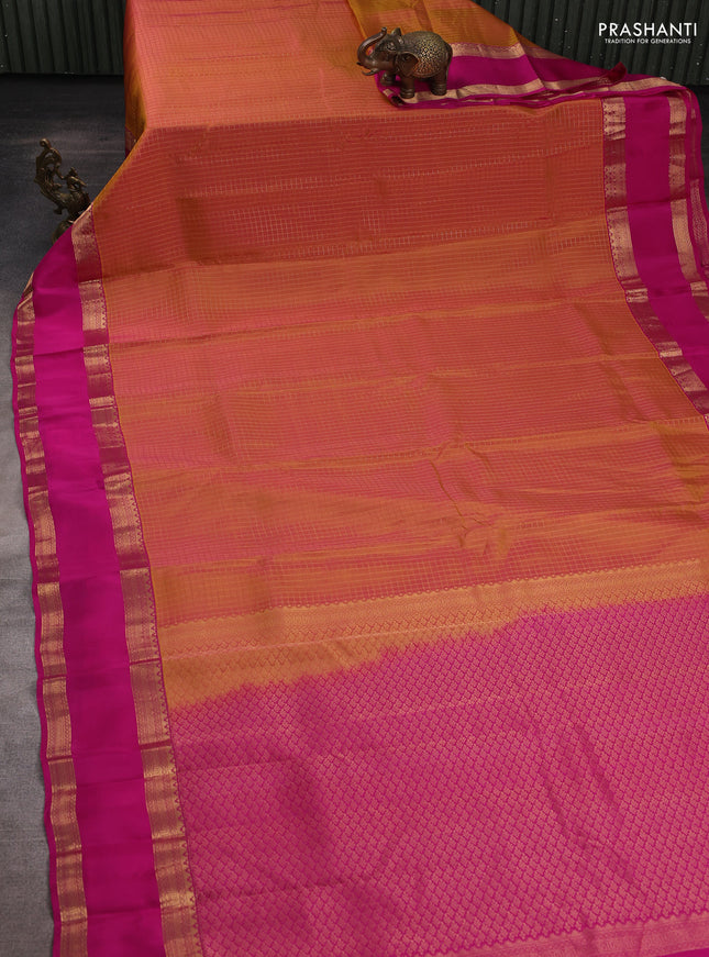 Kanchipuram silk saree dual shade of pinkish orange and pink with allover zari checked pattern and rettapet zari woven border