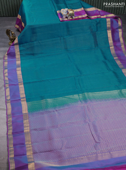 Kanchipuram silk saree teal blue and dual shade of purple with allover zari checked pattern and rettapet zari woven border