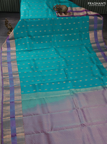 Kanchipuram silk saree teal blue and dual shade of purple with allover zari woven buttas and rettapet zari woven border