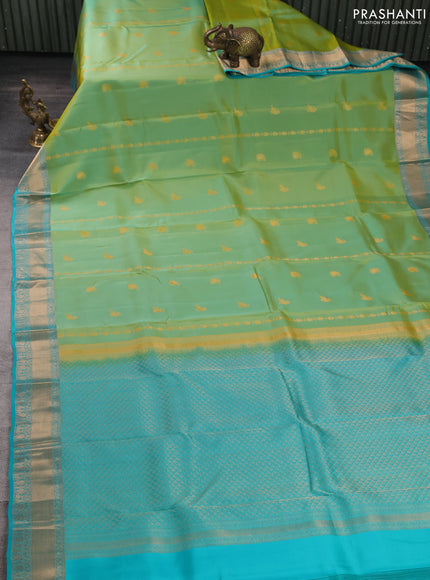 Kanchipuram silk saree dual shade of greenish yellow and teal green with allover zari woven stripes & buttas and zari woven simple border