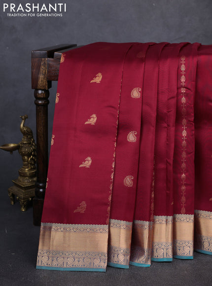 Kanchipuram silk saree deep maroon and dual shade of teal green with allover zari woven buttas and rich zari woven border
